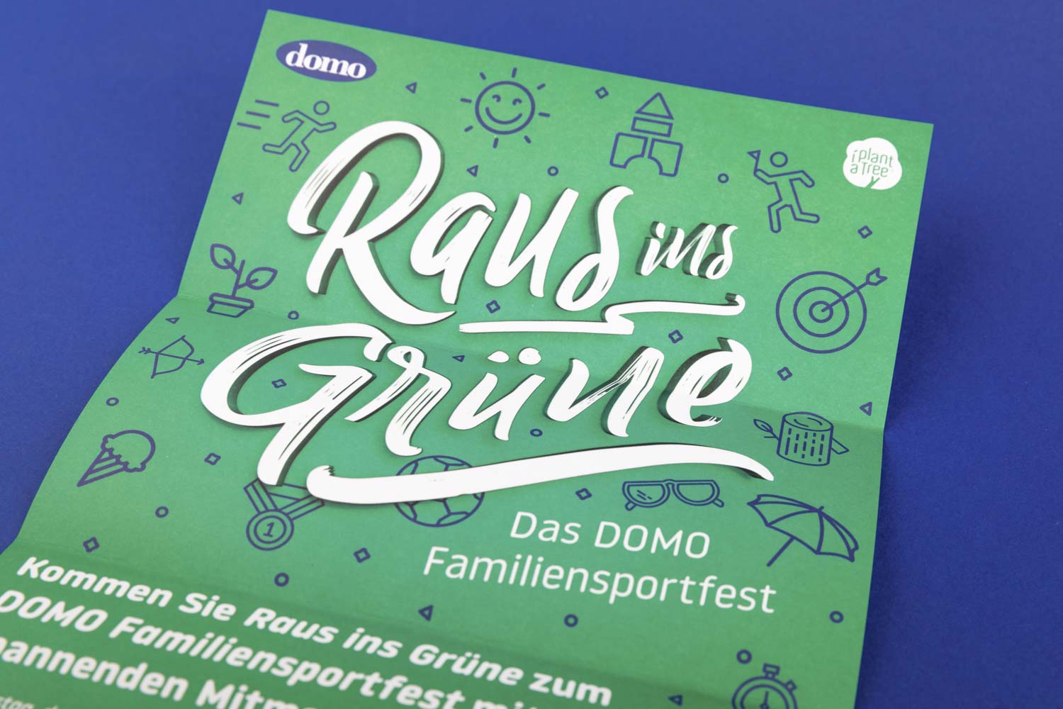 Die Vorderseite der Save-the-Date Karte für das Familien-Sportfest von DOMO:
